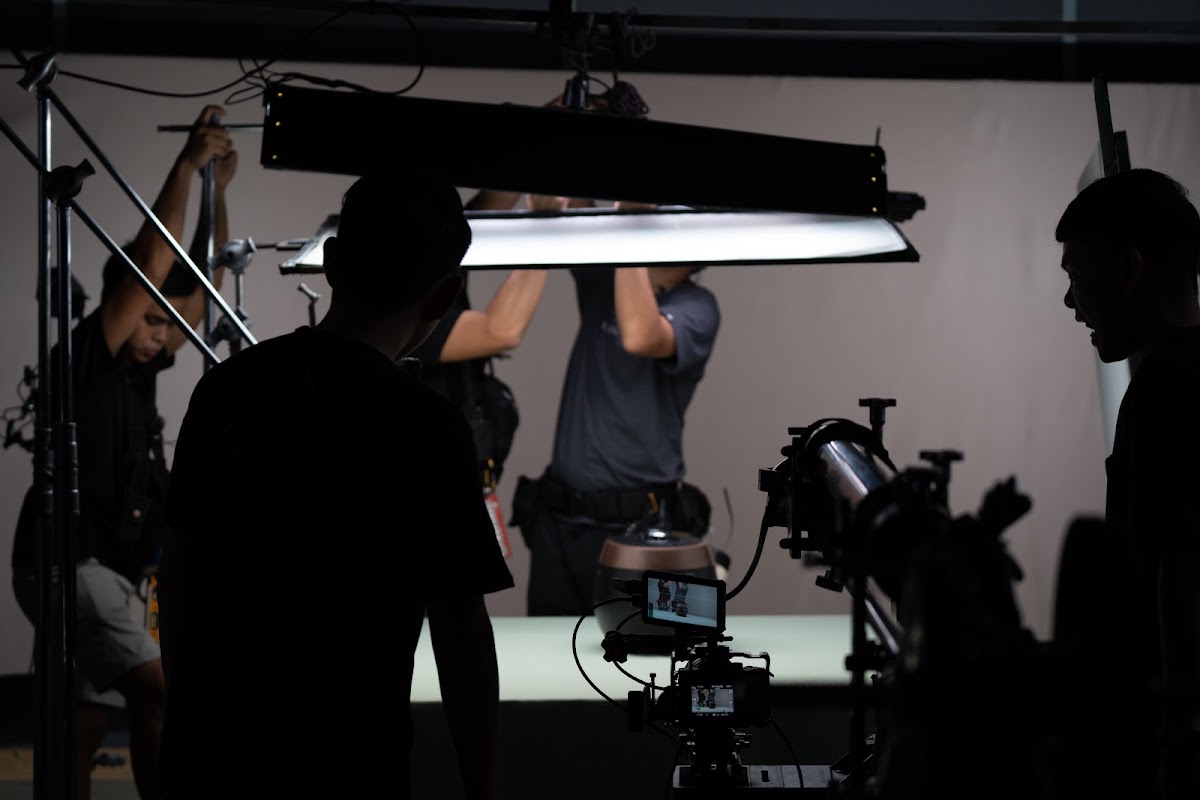 911 Production crew rigging lights on set