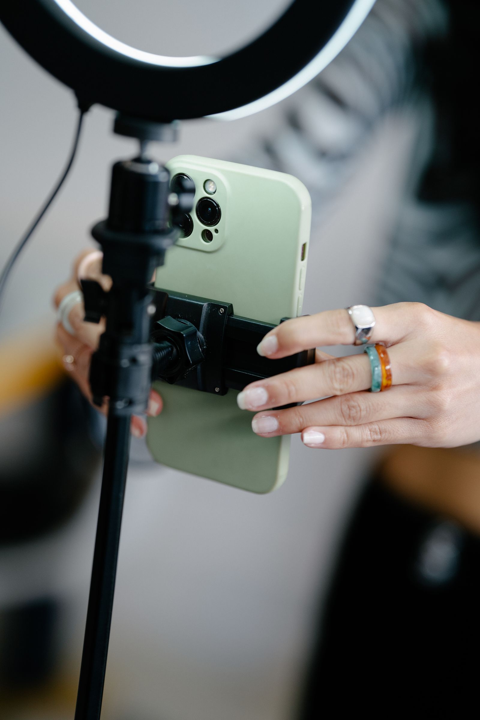 Smartphone mounted on a ring-light rig for content filming