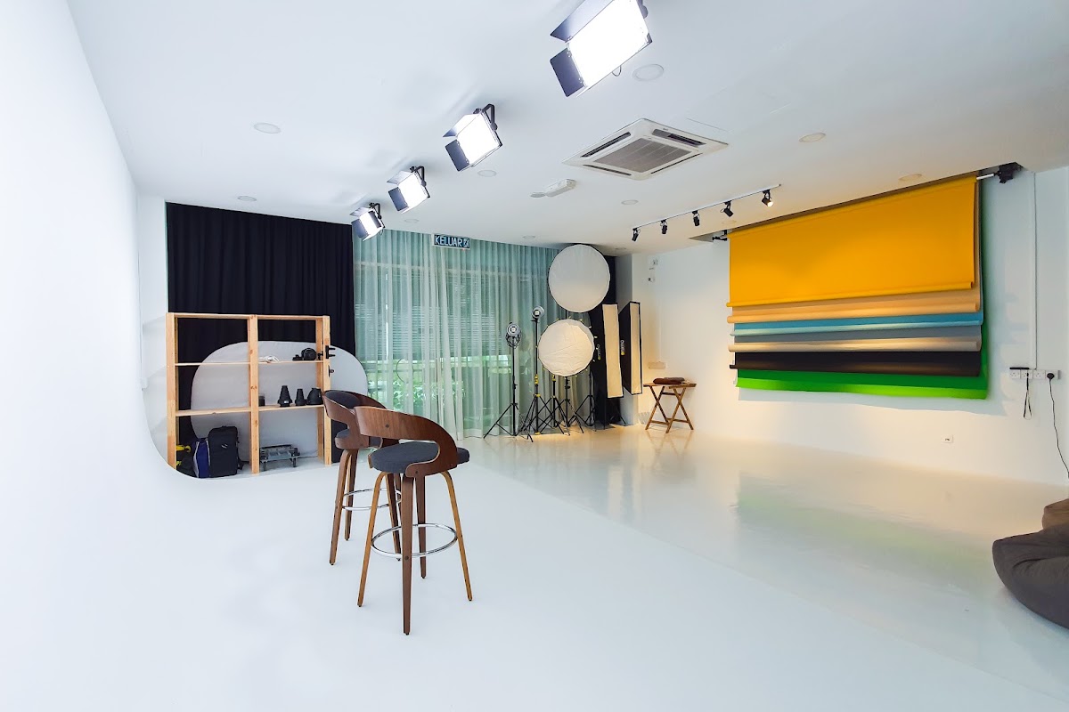 Production studio with lighting rigs and backdrops